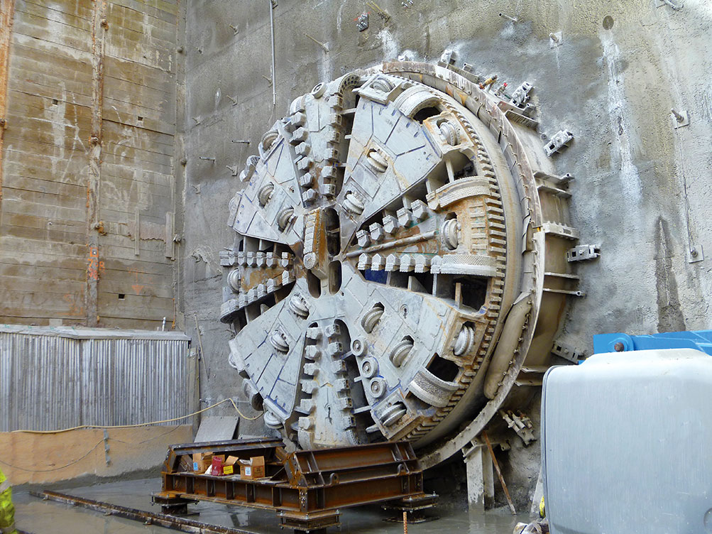 tunnel boring machine hole through at university link light rail project