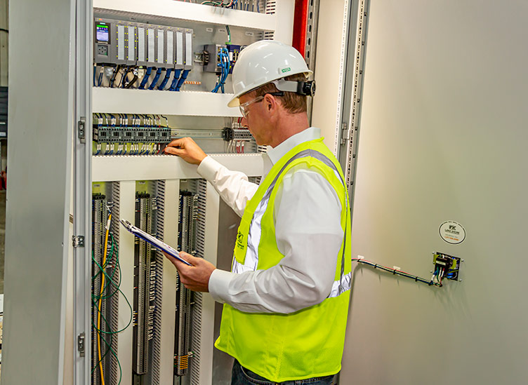 electrical engineer testing electrical panel for mine hoisting system